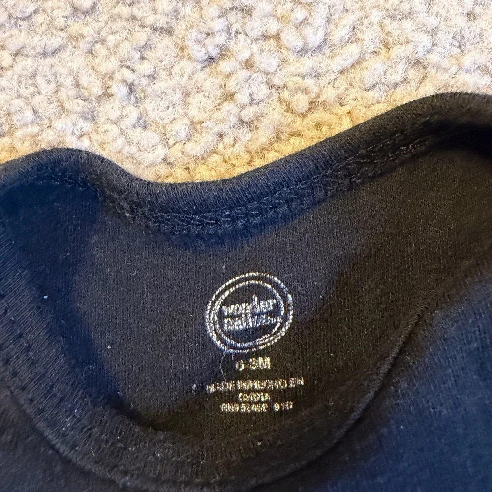 wonder nation Black Baby Bodysuit with White Text “ladies love a milk belly” - Picture 3 of 4